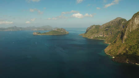 Seascape with tropical bay, rocky islands, ocean blue water, aerial view. islands and mountains...