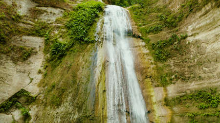 Beautiful waterfall in green forest. Tropical Dao Falls in mountain jungle, Philippines, Cebu. Waterfall in the tropical forest.の写真素材