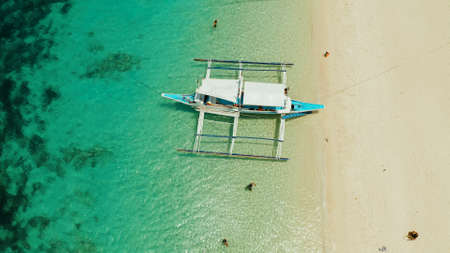 Tropical white sand beach, near the blue lagoon and corall reef from above, Boracay, Philippines....