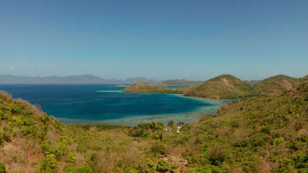 aerial drone tropical islands with blue lagoons, coral reef and sandy beach. Palawan, Philippines. Islands of the Malayan archipelago with turquoise lagoons.の写真素材