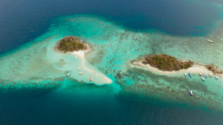 aerial view tropical island with sand white beach. Bulog Dos, Philippines, Palawan. Seascape bay...