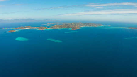 aerial view tropical islands with blue lagoon, coral reef and sandy beach. Palawan, Philippines. Islands of the Malayan archipelago with turquoise lagoons.の写真素材