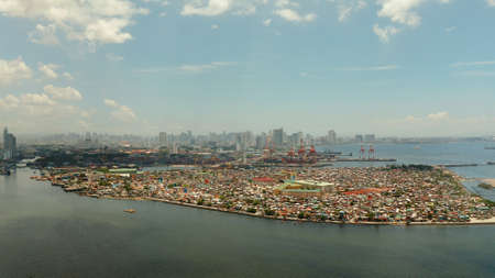 Cityscape of Makati with sea port,the business center of Manila, view from sea. Asian metropolis. Travel vacation concept.の写真素材