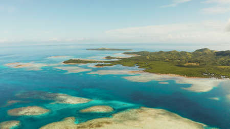 Seascape: Tropical Islands with beaches and azure coral reef water from above. Bucas grande, Philippines. Summer and travel vacation concept.の写真素材
