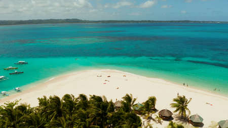 Sand beach and tropical islands, palm trees by atoll with coral reef, top view.Daco island, Philippines. Summer and travel vacation conceptの写真素材