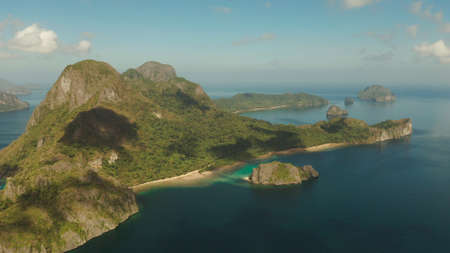 Seascape with tropical bay, rocky islands, ocean blue water, aerial view. islands and mountains...