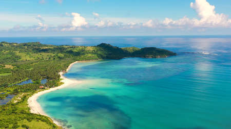 A tropical island with a turquoise lagoon and a sandbank. Caramoan Islands, Philippines. Beautiful islands, view from above. Summer and travel vacation concept.の写真素材