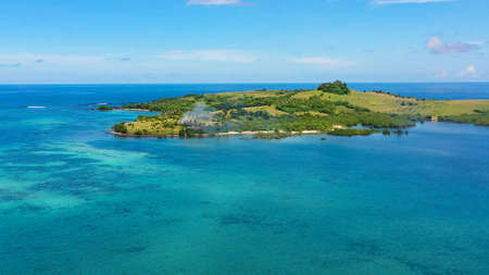 Basot Island, Caramoan , Philippines.Tropical island with green hills,view from above. Summer and...