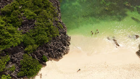 Tropical landscape:Matukad Island with beautiful beach and tourists by turquoise water view from...
