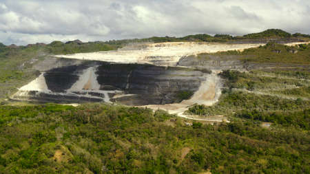Open pit limestone quarry in the mountains of Bohol Island, Philippines. limestone quarry view from...
