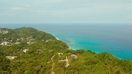 The famous tropical island of Boracay with white beach, hotels among the forest, aerial view. Summer and travel vacation concept.の写真素材