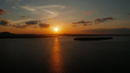 Colorful sunset over tropical islands, aerial view. Sunset over ocean. Balabac, Palawan, Philippinesの写真素材