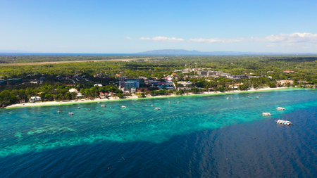 Beautiful tropical beach and turquoise water view from above. Alona beach, Panglao, Philippines. Summer and travel vacation concept.の写真素材