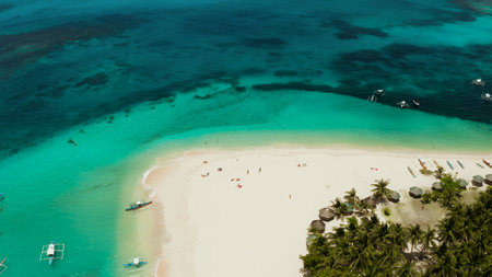 Sand beach and tropical islands, palm trees by atoll with coral reef, top view.Daco island, Philippines. Summer and travel vacation conceptの写真素材