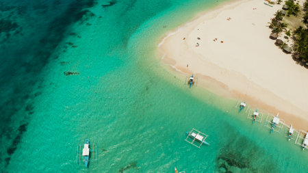Travel concept: sandy beach on a tropical island by coral reef atoll from above. Daco island, Philippines. Summer and travel vacation conceptの写真素材