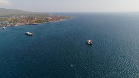 Aerial view ferry port gilimanuk with ferry boats, vehicles. Ferries transport vehicles and passengers in port. Port for departure from Bali to the island of Java.の写真素材
