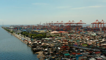 Sea port with container terminal in the city of Manila. Largest cargo port. modern harbor and global trade background ,Philippines.の写真素材