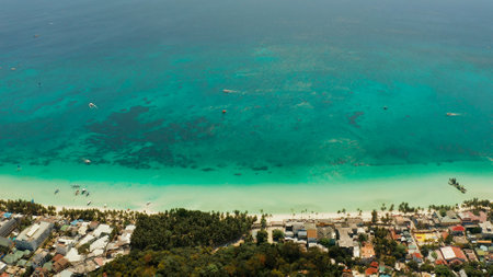 Tropical lagoon with turquoise water, sailing yachts and white sand beach from above. Boracay,...