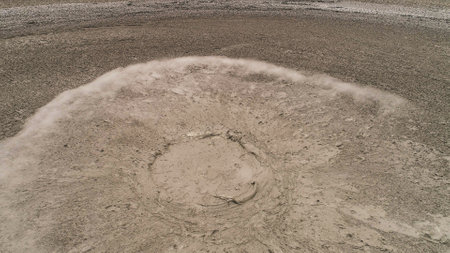 Mud volcano with bursting bubble bledug kuwu. aerial view volcanic plateau with geothermal activity and geysers, Indonesia java. aerial view volcanic landscapeの写真素材