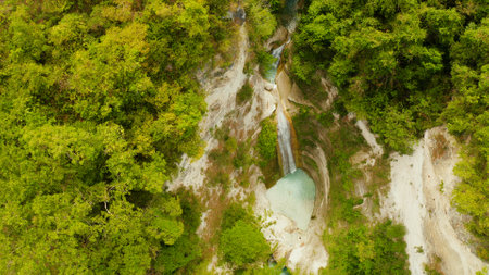 Beautiful waterfall in green forest, top view. Tropical Dao Falls in mountain jungle, Philippines, Cebu. Waterfall in the tropical forest.の写真素材
