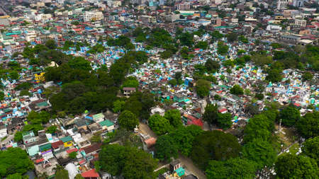 Famous cemetery in the city of Manila, where people live among the graves and crypts top view. Travel concept.の写真素材