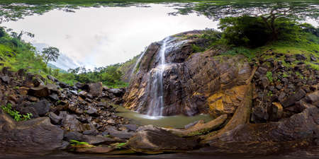 Tropical waterfall falls from the mountain cliff. Diyaluma Falls, Sri Lanka. Virtual Reality 360.