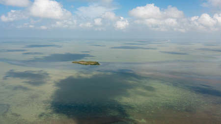 Surface of blue ocean with waves and blue sky with cloud, aerial view. Water cloud horizon...