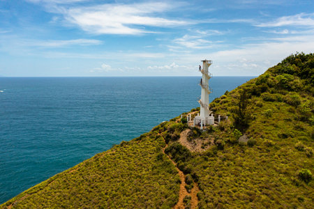 Aerial drone of Lighthouse on a hill against the blue sky. Santa Ana,Luzon, Philippines.の写真素材