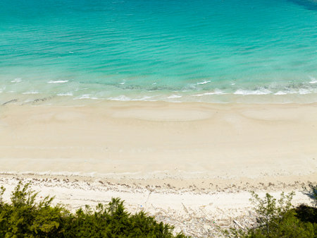 Beautiful sandy beach and sea surf with waves. Borneo, Malaysia.の写真素材