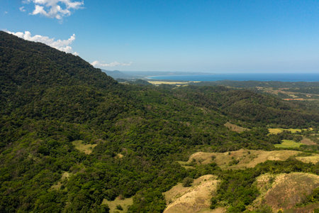 Top view of Mountains with forest and blue sea. Mountain slopes covered with rainforest. Philippines.の写真素材