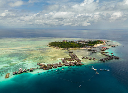 Aerial view of tropical island of Mabul with a beautiful beach and coral reef. Semporna, Sabah, Malaysia.の写真素材