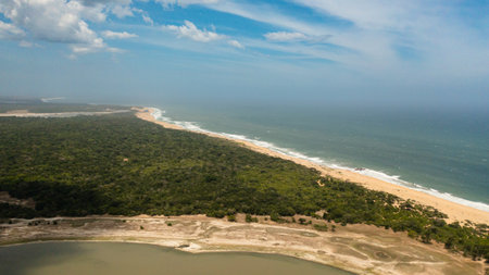 Wild beach in the national park surrounded by rainforest and jungle.の写真素材