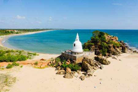 Aerial view of Buddhist monastery, stupa on the beach near the ocean. Sri Lanka.の写真素材