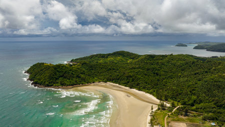 Tropical sandy beach and blue sea. Kimihang beach. Borneo, Sabah, Malaysia.の写真素材