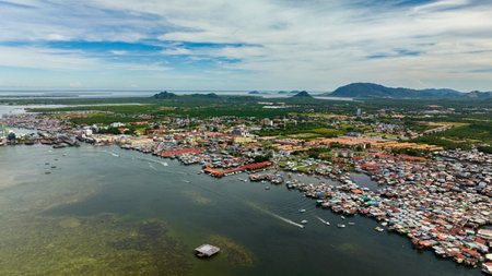 Aerial drone of traditional stilt houses of poor people in the town of Semporna. Borneo, Sabah, Malaysia.の写真素材