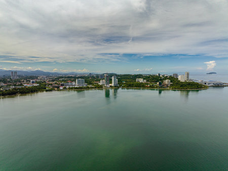 View of the city of Kota Kinabalu from the sea. Borneo, Sabah, Malaysia.の写真素材