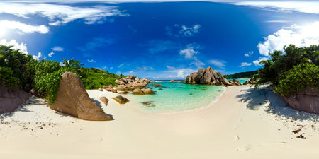 A tropical beach paradise with calm waters, smooth rock formations, and vibrant greenery, creating a...