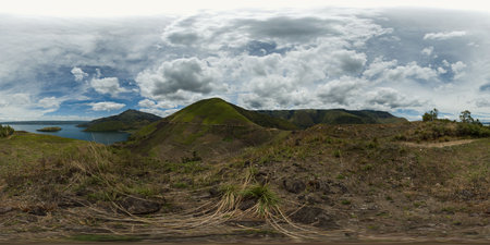A beautiful lake among mountains and volcanoes. Lake Toba and Samosir Island. Sumatra, Indonesia....