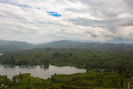 Top view of lake in the mountains among tea estates and plantations Maskeliya, Sri Lanka.の写真素材