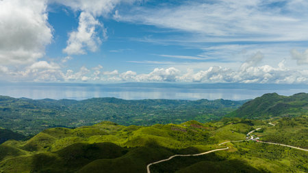 Aerial view of mountains to the sea and the island of Cebu. Negros, Philippinesの写真素材