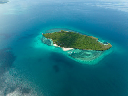 Small island with beach and blue sea.の写真素材