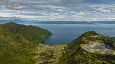 Aerial drone of lake Toba and farmland in the highlands. Sumatra, Indonesia.の写真素材