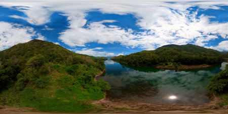A river among the mountains covered with rainforest. Randenigala reservoir.