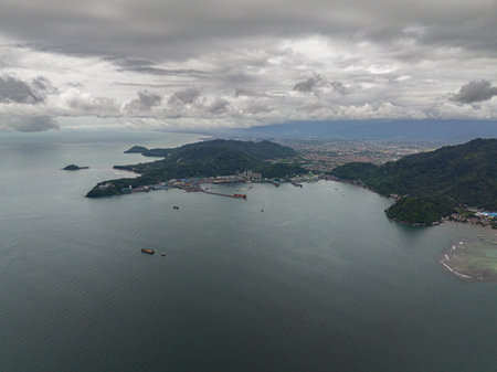 Padang city on the coast of the sea and mountains. Sumatra, Indonesia.