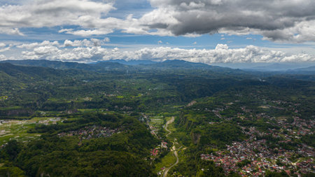 Aerial drone of canyon and valley with rainforest and Mount Singgalang. Ngarai Sianok. Bukittinggi, Sumatra, Indonesia.の写真素材