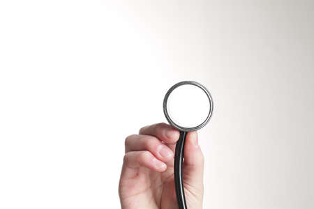 Male hand with stethoscope. Isolated on a white backgroundの写真素材