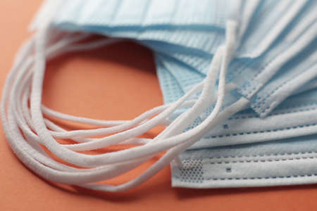 Respiratory masks on orange background.の写真素材