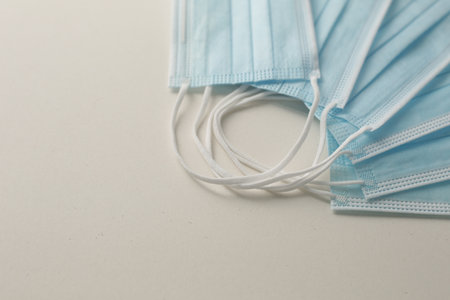 Respiratory masks on gray background. Protective medical mask. Coronavirus protection concept.