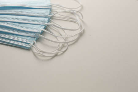 Respiratory masks on gray background. Protective medical mask. Coronavirus protection concept.