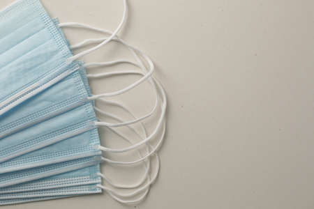 Respiratory masks on gray background. Protective medical mask. Coronavirus protection concept.の写真素材